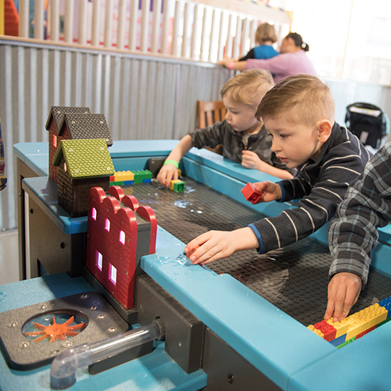 children playing with the Duplo water component